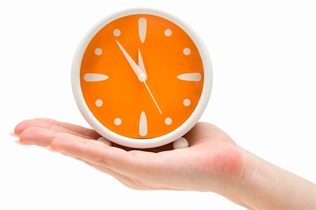 five minutes - Woman holding an orange alarm clock. Isolated on a white background. Stock Photo - Budget Royalty-Free & Subscription, Code: 400-04510997