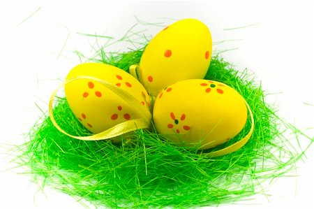 Three yellow easter egge with green grass isolated on white Stock Photo - Budget Royalty-Free & Subscription, Code: 400-04511487
