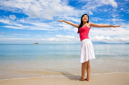 eyedear (artist) - girl with a red tank top and white skirt stretching on a beautiful day at the beach Stock Photo - Budget Royalty-Free & Subscription, Code: 400-04511898