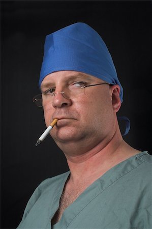 smoking room - A medical surgeon smoking an unhealthy cigarette. Stock Photo - Budget Royalty-Free & Subscription, Code: 400-04512673