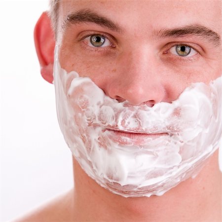 Young man with shaving foam on his face Stock Photo - Budget Royalty-Free & Subscription, Code: 400-04512718