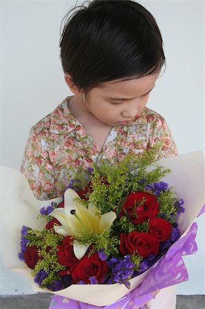 sorry boy pictures - Guilty boy holding flower bouquet feeling sorry Stock Photo - Budget Royalty-Free & Subscription, Code: 400-04512760