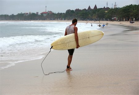 simsearch:400-07212727,k - Lonely the man-surfer on a coastline. Bali Stock Photo - Budget Royalty-Free & Subscription, Code: 400-04512847