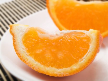 simsearch:400-04433511,k - Orange slice on  a white plate Stock Photo - Budget Royalty-Free & Subscription, Code: 400-04512965