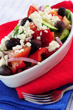 person eating greek salad - Greek salad with feta cheese and black kalamata olives Stock Photo - Budget Royalty-Free & Subscription, Code: 400-04513146