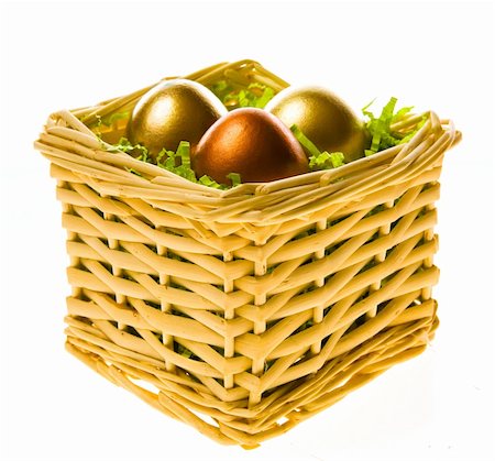 simsearch:400-05040794,k - Three eggs, two gold and one bronze in a small basket on a white background Stock Photo - Budget Royalty-Free & Subscription, Code: 400-04513211