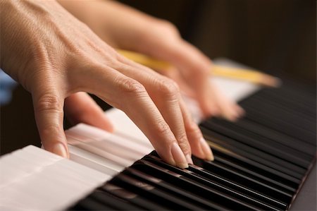 Woman's Fingers with Pencil on Digital Piano Keys Stock Photo - Budget Royalty-Free & Subscription, Code: 400-04513562