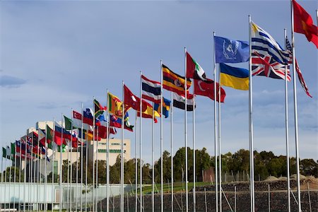 flag pole row - flags of the world flapping in the wind Stock Photo - Budget Royalty-Free & Subscription, Code: 400-04513806