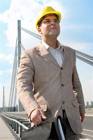 Businessman walking to work over bridge Stock Photo - Budget Royalty-Free & Subscription, Code: 400-04524117