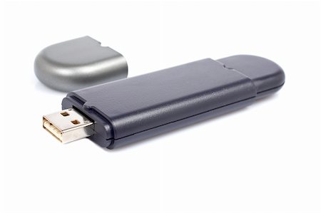 simsearch:400-04730368,k - Portable flash usb pen drive memory with soft shadow on white background. Shallow depth of field Photographie de stock - Aubaine LD & Abonnement, Code: 400-04524210