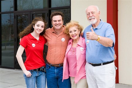 Family standing outside their polling place wearing I Voted stickers.  (stickers are generic ones, not trademarked) Stock Photo - Budget Royalty-Free & Subscription, Code: 400-04524344