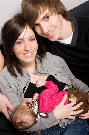 Happy young parents with their baby girl Stock Photo - Budget Royalty-Free & Subscription, Code: 400-04524797