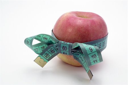 simsearch:400-04271582,k - Red Apple with measuring tape. Photographie de stock - Aubaine LD & Abonnement, Code: 400-04524959