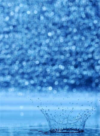 falling into swimming pool - splash and blur bacground. A water table with effective drops stains on water Stock Photo - Budget Royalty-Free & Subscription, Code: 400-04525265