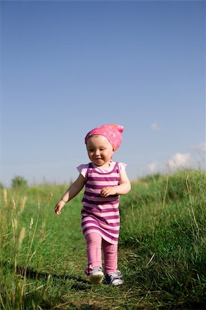 simsearch:400-04067084,k - happy baby girl on green meadow Stock Photo - Budget Royalty-Free & Subscription, Code: 400-04525305