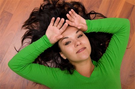 brunette woman lying on the floor Stock Photo - Budget Royalty-Free & Subscription, Code: 400-04525332