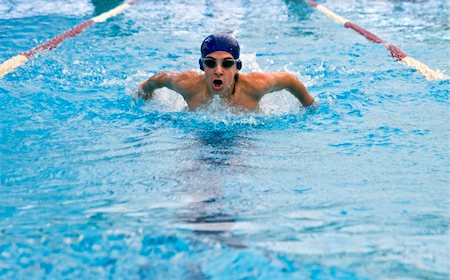 teenager swimmer in a butterfly stroke Fotografie stock - Microstock e Abbonamento, Codice: 400-04525431