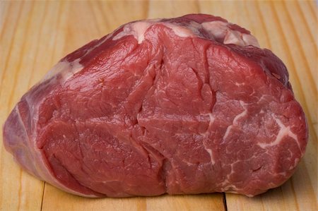 prime rib - piece of raw meat on a wooden chopping board Stock Photo - Budget Royalty-Free & Subscription, Code: 400-04525660
