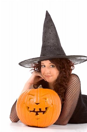 simsearch:400-04007612,k - Portrait of Hispanic teenager girl in black Halloween hat and fishnet dress with carved pumpkin (Jack O' Lantern) Stock Photo - Budget Royalty-Free & Subscription, Code: 400-04525682