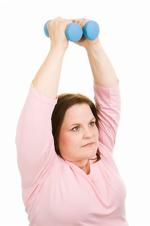 Beautiful plus-sized model doing pilates with free weights.  Isolated on white. Foto de stock - Super Valor sin royalties y Suscripción, Código: 400-04526289