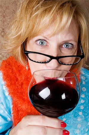 Crazy woman with wild eyes drinking wine Stock Photo - Budget Royalty-Free & Subscription, Code: 400-04526579