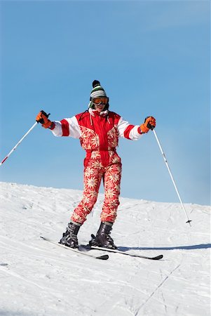 simsearch:400-04117720,k - Happy ski girl in red Photographie de stock - Aubaine LD & Abonnement, Code: 400-04527079