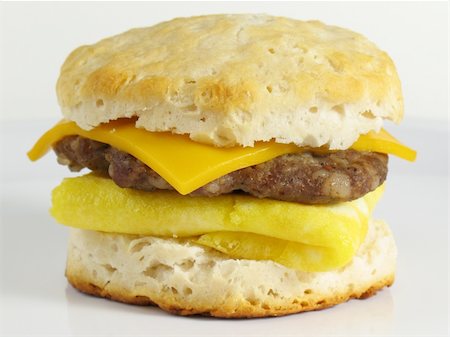 simsearch:400-07568675,k - Start your morning right with this delicious breakfast sandwich… a fresh baked buttermilk biscuit with a sausage patty, eggs, and cheese! Foto de stock - Super Valor sin royalties y Suscripción, Código: 400-04527133