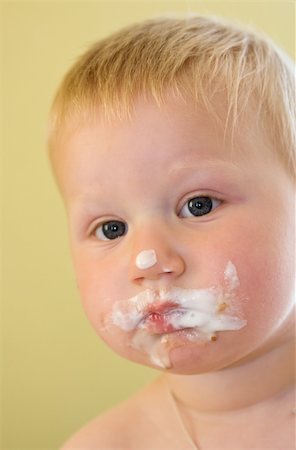 toddler boy with his face dirty in ice-cream Stock Photo - Budget Royalty-Free & Subscription, Code: 400-04527272