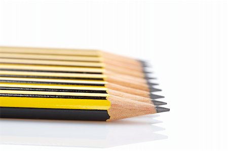 simsearch:400-06138260,k - Assortment of pencils reflected on white background. Shallow depth of field Stock Photo - Budget Royalty-Free & Subscription, Code: 400-04527300