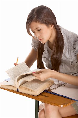 examination folder - Asian student girl sitting by the desk and studying English dictionary in preparation for test, exam or spelling bee contest Stock Photo - Budget Royalty-Free & Subscription, Code: 400-04527316