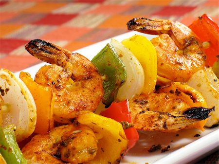 shrimp kebab - A platter of spicy shrimp kebabs with colorful bell peppers and onions. Generously seasoned with cayenne pepper. Stock Photo - Budget Royalty-Free & Subscription, Code: 400-04527556