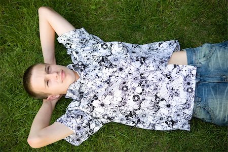happy boy lying on grass Stock Photo - Budget Royalty-Free & Subscription, Code: 400-04527768