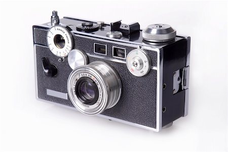 simsearch:400-04527928,k - Side view of classic film rangefinder camera Foto de stock - Super Valor sin royalties y Suscripción, Código: 400-04527921