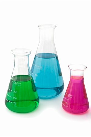 three lab flasks with blue green and magenta fluids Foto de stock - Super Valor sin royalties y Suscripción, Código: 400-04528203