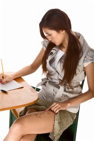 picture cheating school - Young Asian female student stands by school desk and rights mathematical formulas on her thigh, so to be able to use cheat using it during math exam Stock Photo - Budget Royalty-Free & Subscription, Code: 400-04528725