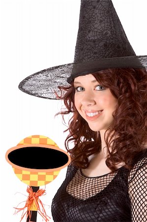 simsearch:400-04028019,k - Portrait of Latina teenager girl in black Halloween hat and fishnet dress holding blank black sign Foto de stock - Super Valor sin royalties y Suscripción, Código: 400-04528727