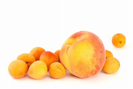 simsearch:400-07667203,k - Orange peach and some apricots isolated on the white background Stock Photo - Budget Royalty-Free & Subscription, Code: 400-04529371
