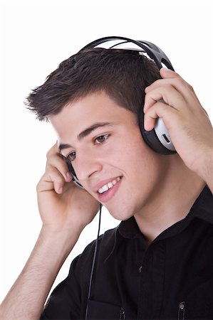 Young man, enjoying music with headphones. Isolated on white. Stock Photo - Budget Royalty-Free & Subscription, Code: 400-04529542