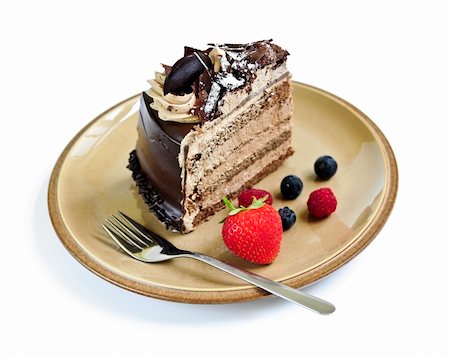 Slice of chocolate mousse cake served on a plate on white background Stock Photo - Budget Royalty-Free & Subscription, Code: 400-04529620