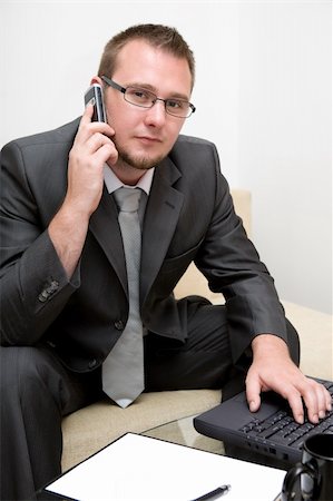 simsearch:400-04651437,k - happy man sitting on sofa with laptop Stockbilder - Microstock & Abonnement, Bildnummer: 400-04529646