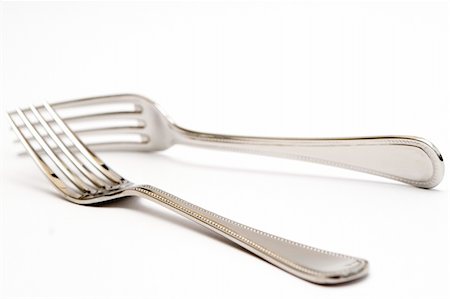 rosliothman (artist) - Pair of silver forks set on a white background - isolated Foto de stock - Super Valor sin royalties y Suscripción, Código: 400-04529920