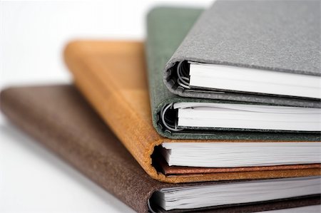 simsearch:400-03990507,k - Stack of notebooks  with color cover over white Stock Photo - Budget Royalty-Free & Subscription, Code: 400-04520303