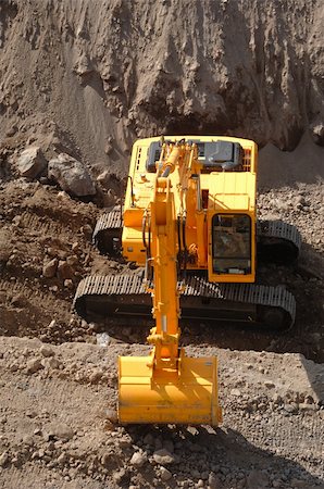 simsearch:400-05111345,k - Excavator working at a conctuction site Fotografie stock - Microstock e Abbonamento, Codice: 400-04520330