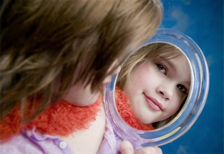 simsearch:400-05197146,k - Little Girl Playing Dress-Up Looking in a Handheld Mirror Stock Photo - Budget Royalty-Free & Subscription, Code: 400-04520712