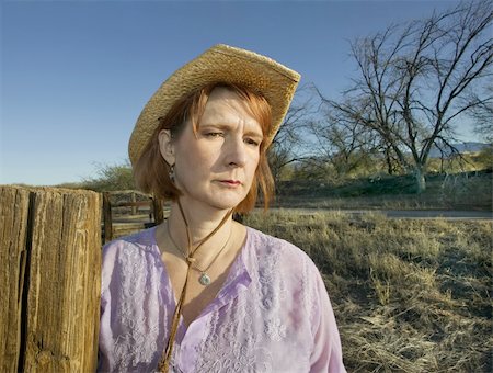 ranchers - Portrait of a woman in a purple shirt and cowboy hat on a ranch. Stock Photo - Budget Royalty-Free & Subscription, Code: 400-04520740