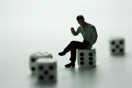 simsearch:400-05288074,k - A business man thinking on dice. Stock Photo - Budget Royalty-Free & Subscription, Code: 400-04521011