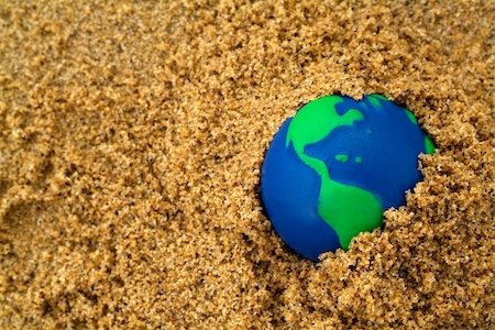 simsearch:633-03445015,k - blue and green globe buried in sand Foto de stock - Super Valor sin royalties y Suscripción, Código: 400-04521641