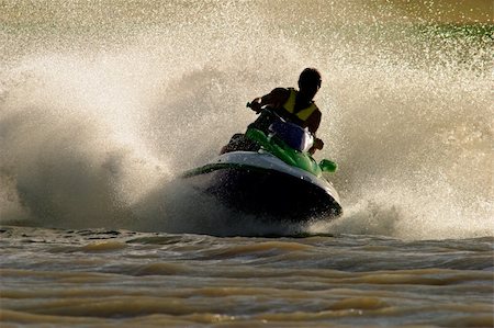 Backlit jet ski with water spray Stock Photo - Budget Royalty-Free & Subscription, Code: 400-04521727