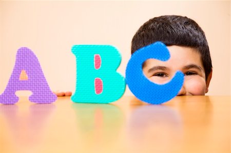 simsearch:400-05178086,k - child learning the ABC's. The focus i son the his eyes Photographie de stock - Aubaine LD & Abonnement, Code: 400-04521807