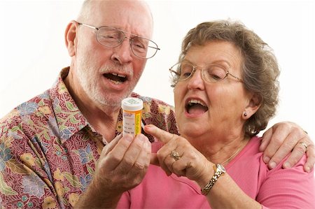 simsearch:400-04522125,k - Senior Couple reads a prescription bottle. Stock Photo - Budget Royalty-Free & Subscription, Code: 400-04522127